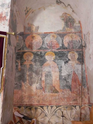 Close up of a wall fresco showing 3 archangels
